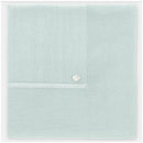 Light pink Martin Aranda Blanket Knit Edmonton, featuring textured knit sections and a decorative button detail.