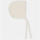 Sweater knit cotton blend bonnet in a light cream color, featuring ties for secure fit.