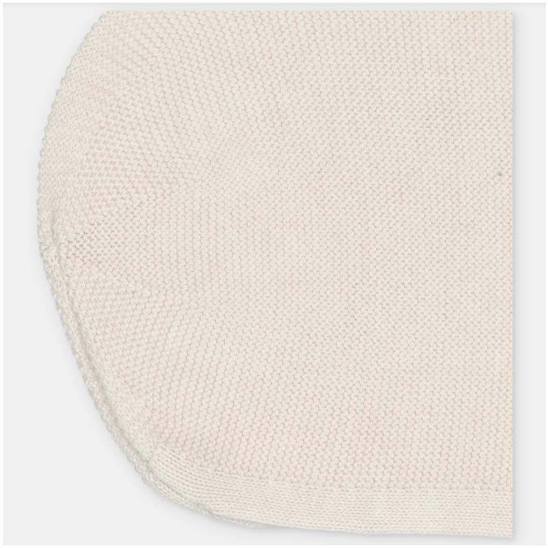 Cream-colored knit cotton blend bonnet with a textured stitch and slightly rounded shape.