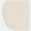 Cream-colored knit cotton blend bonnet with a textured stitch and slightly rounded shape.