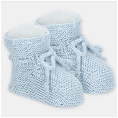Light pink knitted booties with a soft inner lining and tied bows, designed for infants.