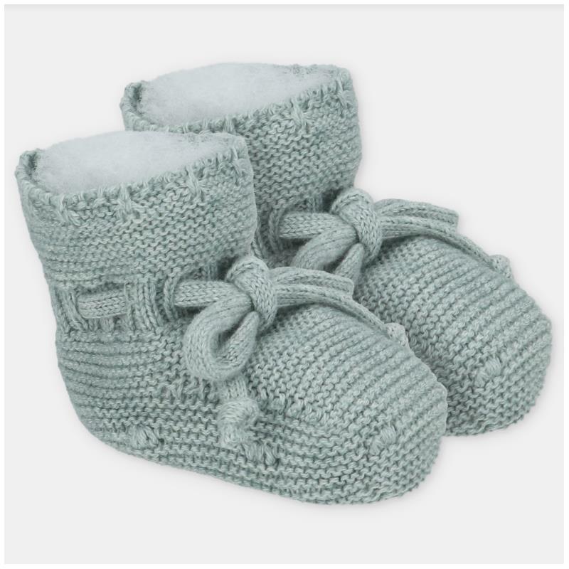 Knit booties in soft baby pink with a cozy lining and decorative bow, perfect for infants.