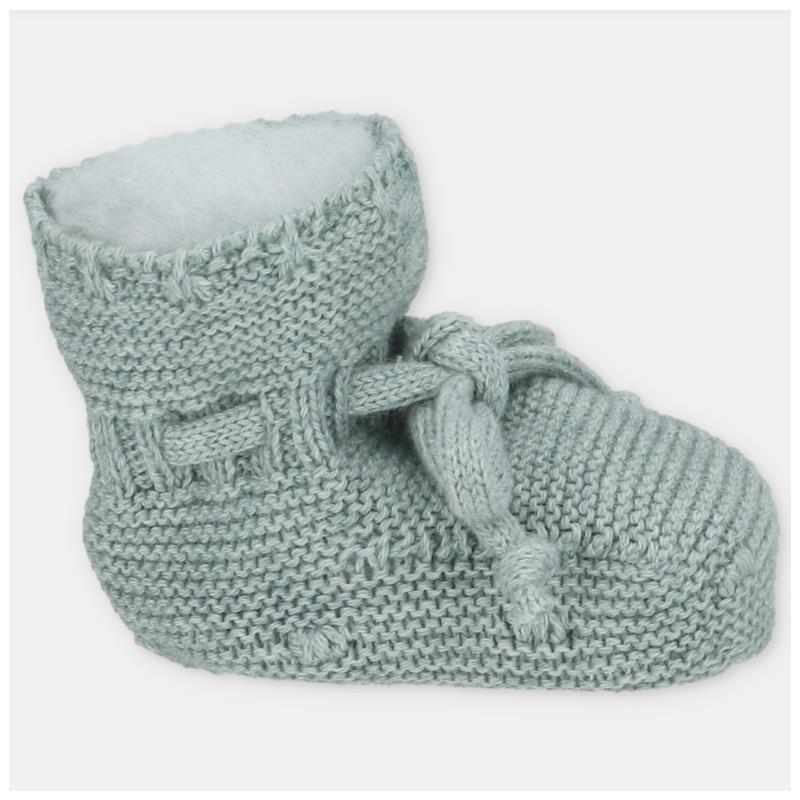 Knit baby booties in light pink, featuring a cozy lining and a decorative tie detail.