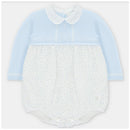 Pastel blue romper with a knitted top and polka dot woven bottom; features a collar and front buttons.