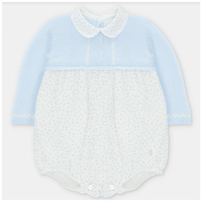 Pastel blue romper with a knitted top and polka dot woven bottom; features a collar and front buttons.