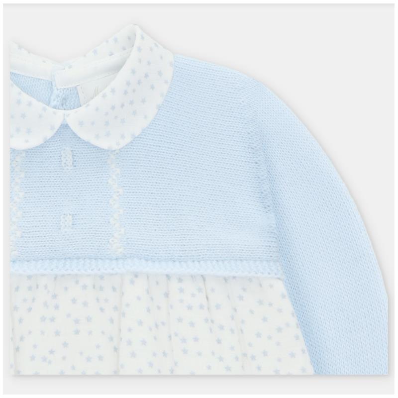 Pastel blue Draylon knit and woven short romper featuring a collared neck and star-patterned skirt.