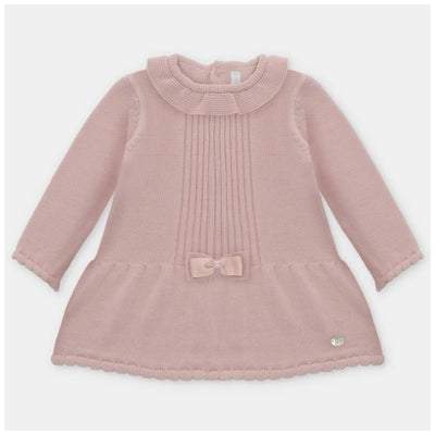 Dusty rose knitted dress featuring a ribbed design, rounded collar, long sleeves, and a bow detail at the waist.
