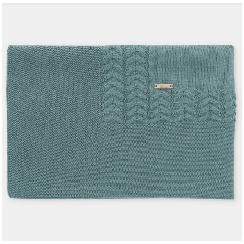 Blue-grey Draylon sweaterknit blanket by Martin Aranda, featuring a textured cable knit design and a small logo tag.