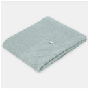 Dusty rose Draylon Sweaterknit Blanket with ribbed texture and button detail, ideal for warmth and comfort.