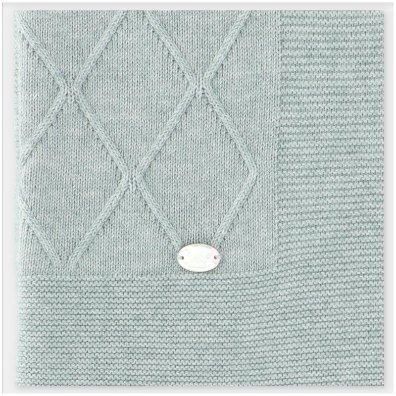 Dusty rose Draylon sweaterknit blanket featuring a textured diamond pattern and a decorative tag at the corner.