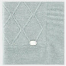 Dusty rose Draylon sweaterknit blanket featuring a textured diamond pattern and a decorative tag at the corner.
