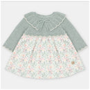 Martin Aranda dress featuring a knitted top in soft green with a lace collar, and a floral fabric skirt in pink and cream tones.