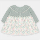 Martin Aranda dress featuring a sweater knit top in light gray and a floral fabric skirt with pastel colors.