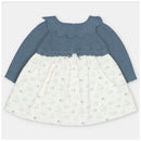 Martin Aranda dress featuring a blue sweater knit bodice with a scalloped collar and a patterned white fabric skirt.