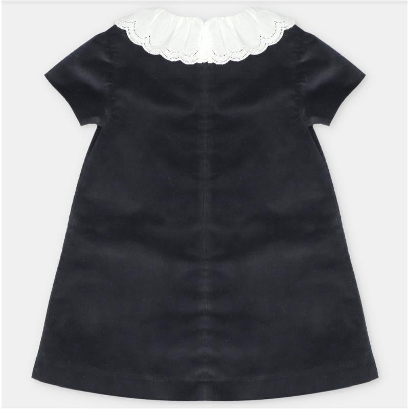 Martin Aranda Dress in woven black fabric featuring a decorative white scalloped collar and short sleeves.
