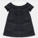 Martin Aranda Dress in woven black fabric featuring a decorative white scalloped collar and short sleeves.