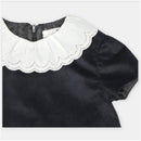 Martin Aranda Dress in Pesoz Black, featuring a scalloped white collar and zip closure at the back.