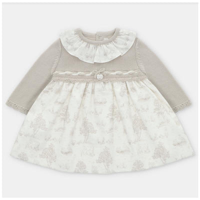 Knit and woven mix dress in Newport and stone colors, featuring a frilly collar and floral print skirt.