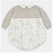 Knit and woven short romper in Newport and stone colors, featuring a light grey top and a patterned white bottom.