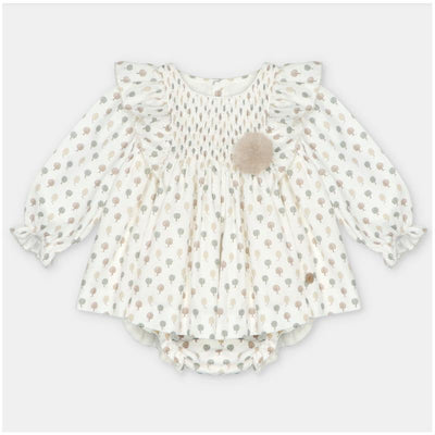 Woven beige dress and bloomer set with tree patterns and a decorative pom-pom, suitable for children.