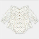 Woven beige baby dress and bloomer set featuring a tree pattern, ruffled collar, and button details.