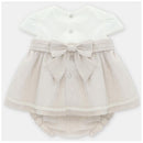Linen beige dress with a white top, bow belt, and matching bloomer, featuring decorative buttons and lace trim.