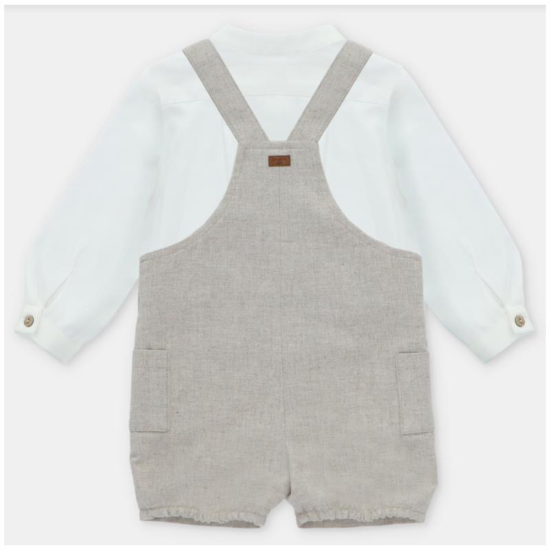 White long-sleeve shirt paired with beige overall shorts featuring two side pockets and adjustable straps.