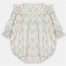 Short romper in Pravia Green with floral pattern, featuring puffed sleeves and button closure at the back.