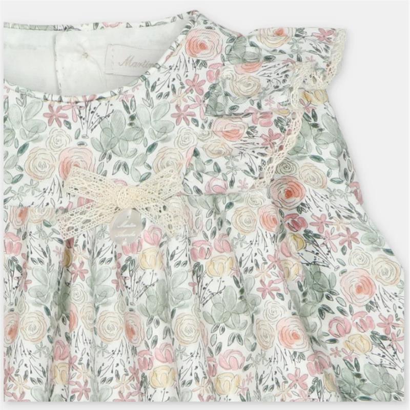 Short romper in Pravia Green with floral pattern, lace trim, and a bow detail at the front.
