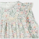 Short romper in Pravia Green with floral pattern, lace trim, and a bow detail at the front.