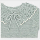 Sage green sweater knit top featuring a scalloped yoke design and a bow tie closure at the neck.