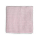 Waffle blanket in ballet slipper pink, featuring a textured woven design, perfect for infants and toddlers.