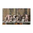 Mary Meyer Putty Nursery Character Blanket featuring a piglet among a collection of plush animal toys on a shelf.