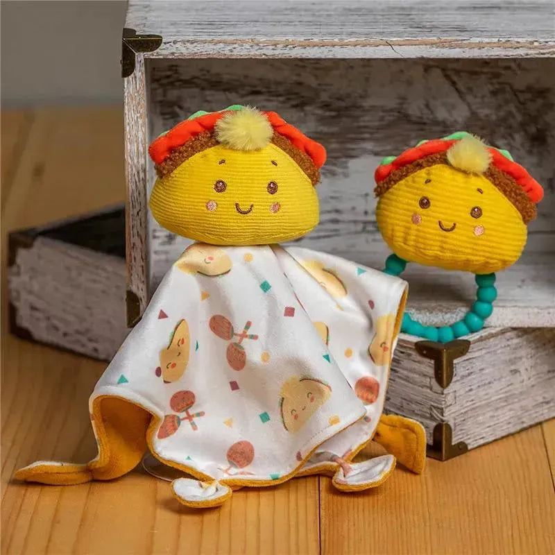 Mary Meyer Sweet Soothie set featuring a taco-shaped plush blanket buddy and a teething ring, both with vibrant colors and cheerful designs.