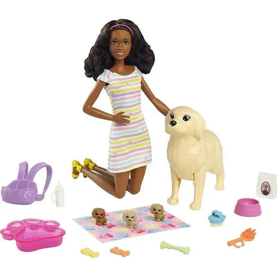 Brunette Barbie doll wearing a striped dress kneels next to a golden retriever puppy, surrounded by pet accessories and toys.