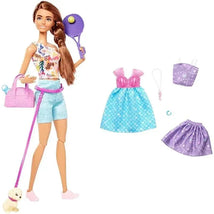 Barbie Wellness Doll holding a tennis racket, wearing sporty attire, with three outfits and a puppy on a leash.