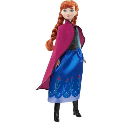 Mattel Disney Frozen Core Doll, Anna, featuring a long blue dress with floral designs and a pink cape.