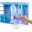Disney Frozen Elsa Ice Castle Playset featuring a hand interacting with the playset, showcasing shelves and details inside.