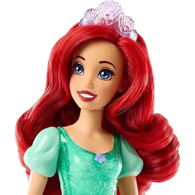 Disney Princess Ariel fashion doll with long red hair, blue eyes, wearing a sparkling green dress and a tiara.