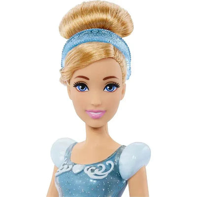 Disney Princess Cinderella fashion doll featuring blonde hair, blue dress with sparkles, and a matching headband.
