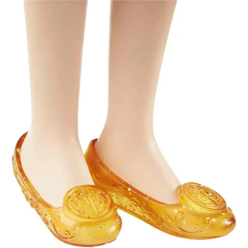 Yellow plastic flats with decorative swirls and rose motifs, designed for children and inspired by Disney Princess styles.