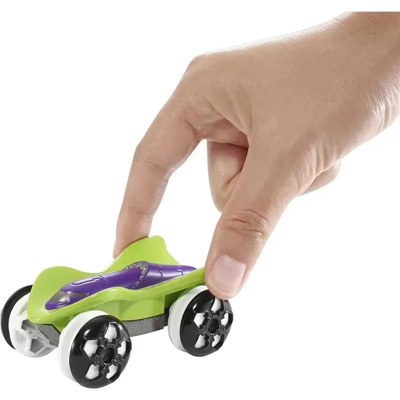 Hot Wheels Color Shifters toy car in vibrant green and purple, being operated by a hand.