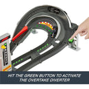 Hot Wheels Race Formula 1 Grand Prix Circuit Track Set features a track with a hand pressing a green button to activate the diverter.