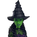 Wicked Core Doll of Elphaba with green skin, textured black hat, and stylish outfit featuring purple accents.