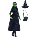 Wicked Core Doll of Elphaba by Mattel, featuring a green-skinned figure in a black dress, with a witch hat and handbag.
