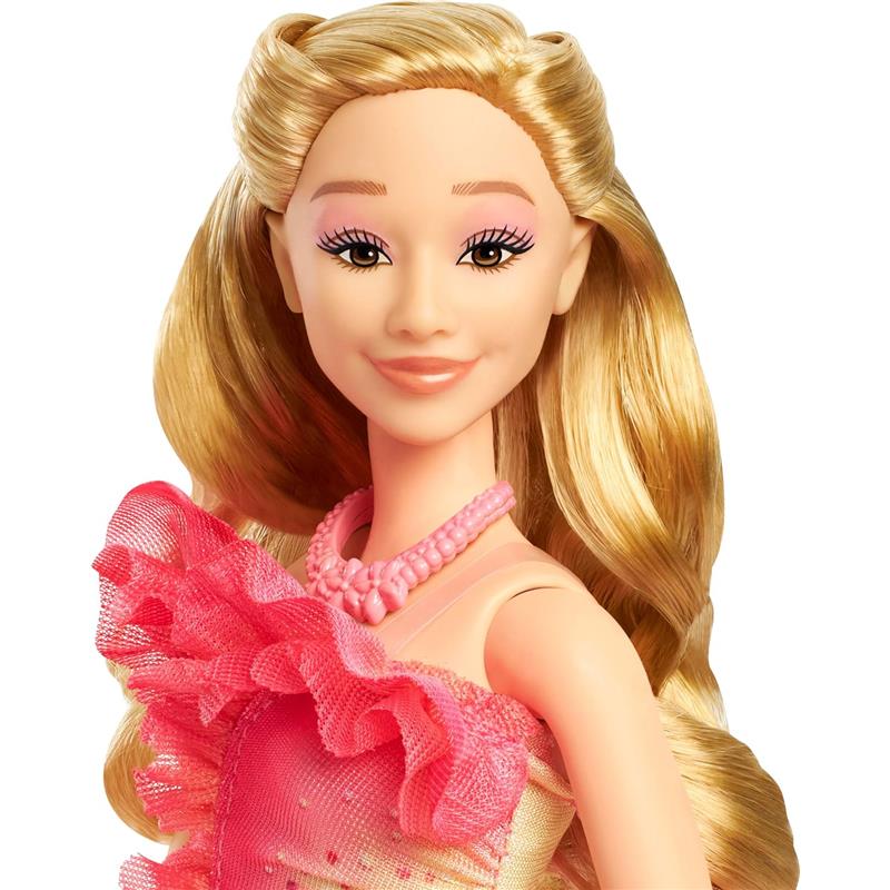 Wicked Core Doll Glinda by Mattel features a smiling doll with long blonde hair, wearing a pink ruffled dress and necklace.