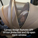 Maxi-Cosi Ambra Infant Car Seat in Truffle color with a canopy featuring UPF 50 sun protection and a mesh window, containing a child.