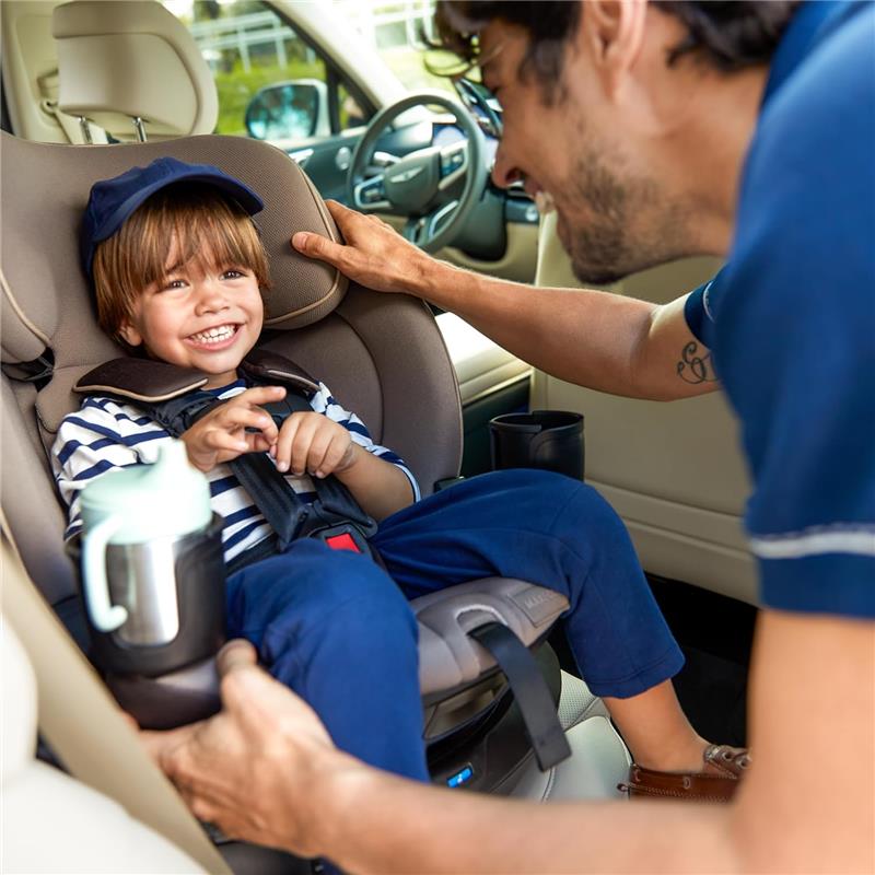 Maxi-Cosi Andi 360 Rotating All-in-One Convertible Car Seat in Truffle, with a smiling child securely buckled and enjoying a drink.