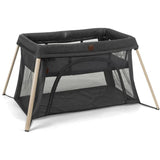 Maxi-Cosi Calao Travel Play Yard in Classic Graphite with wooden legs and mesh panels for visibility and ventilation.
