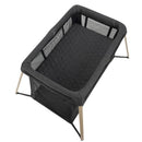Maxi-Cosi Calao Travel Play Yard in Classic Graphite, featuring a quilted mattress and mesh sides for airflow.